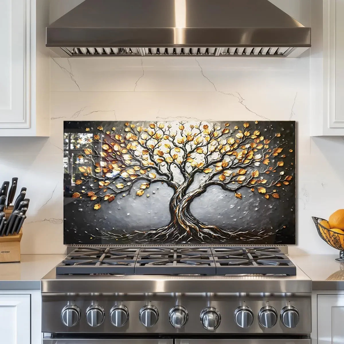 Tempered glass stove splashback protector with Tree of Life design installed above stainless steel range