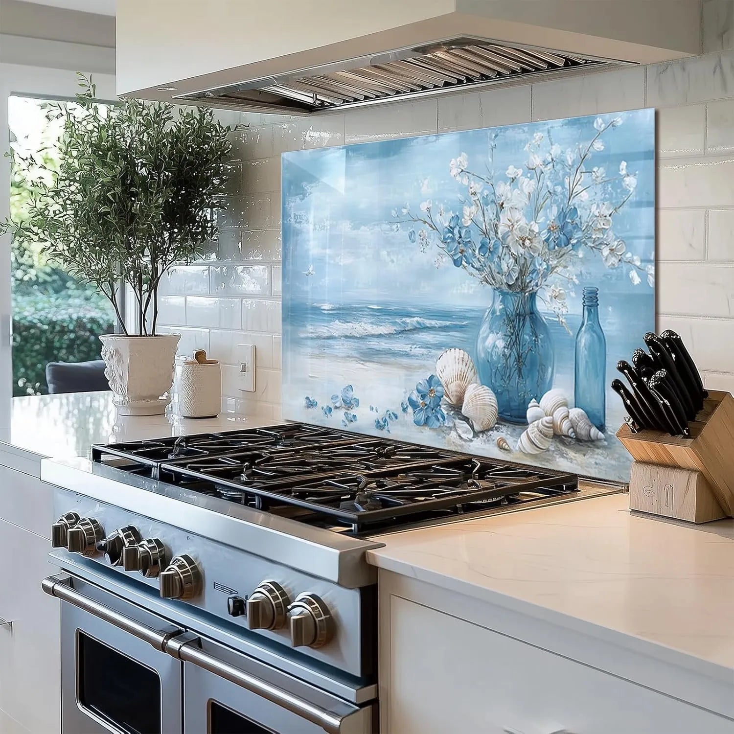 Bright kitchen with blue beach tempered glass backsplash featuring shells and vase
