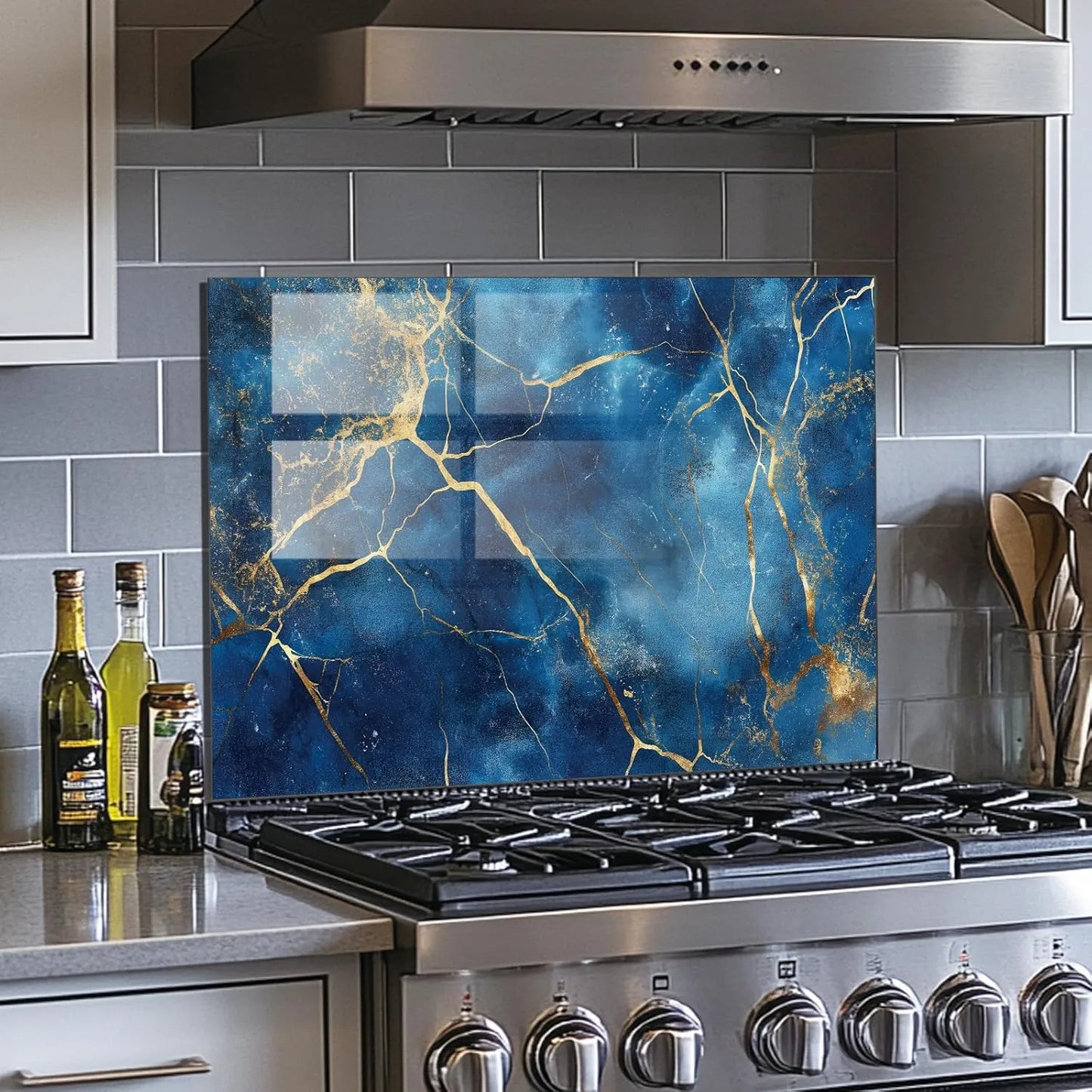 Blue gold abstract tempered glass kitchen backsplash with light gray subway tiles